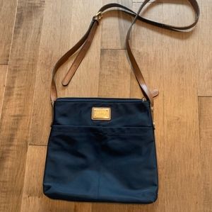 Calvin Klein navy blue purse with brown adjustable shoulder strap. EUC!